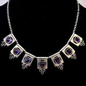 Deco-style necklace with silver stations & faceted amethyst-color inserts